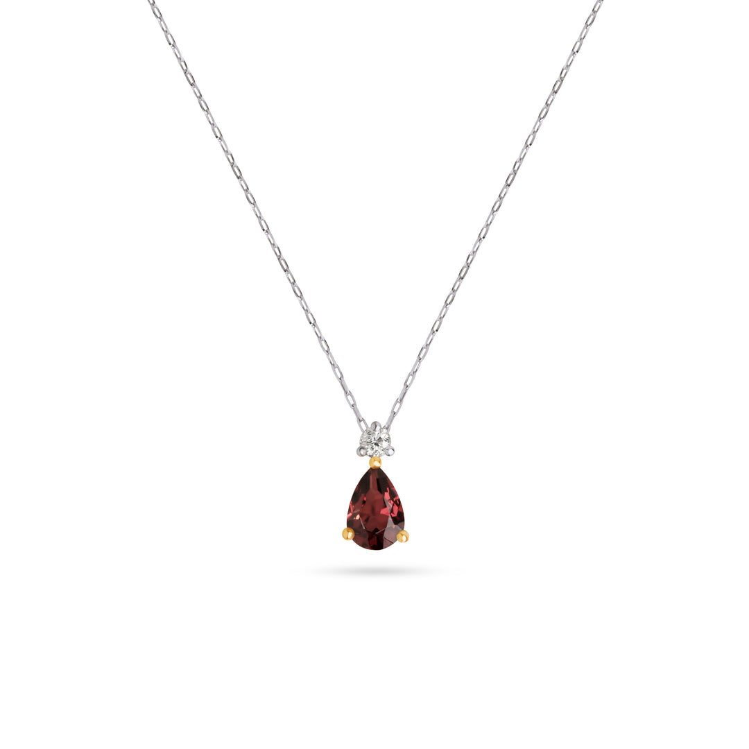 Natural pear shaped red garnet pendant necklace featuring a 0.53ct garnet, natural diamond accent and yellow gold prongs on a platinum chain. Ocean Bleu Fine Jewellery Singapore.